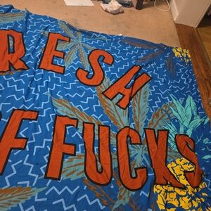 Spencer's Blue Tropical 'Fresh Fucks' Banner with Orange Lettering